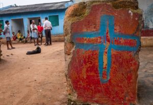 A group of Christians meet together near their rebuilt church in Kandhamal. During the Summer of 2008, almost every church in the Kandhamal area was destroyed by Hindu nationalists aligned with Prime Minister Narendra Modi’s BJP party, along with a local government mandate that made Christianity illegal during that time. Local Christian leaders report that there are twice as many churches in the area now as compared to 2008. Kandhamal, India. 2018. Photo: John Fredricks